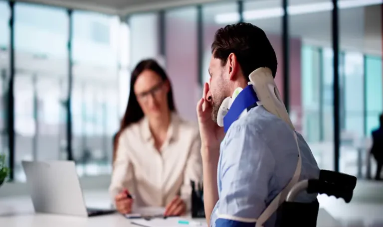 personal injury lawyer NYC consulting injured client with neck brace