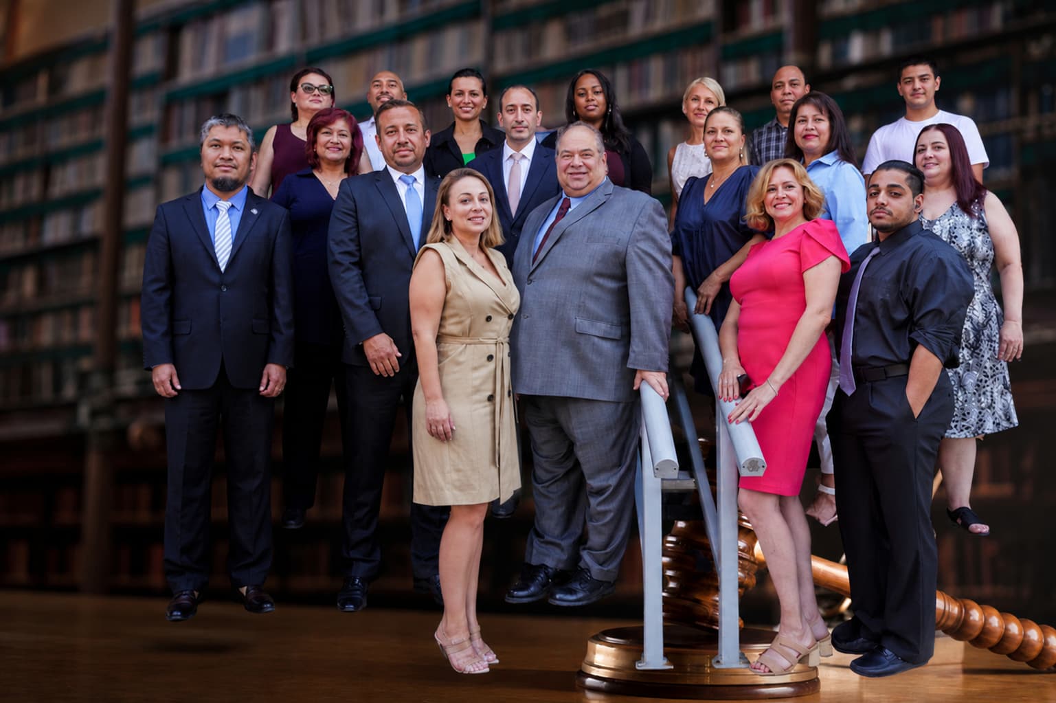 The Rybak Firm PLLC full legal team and staff posing in law library Brooklyn New York