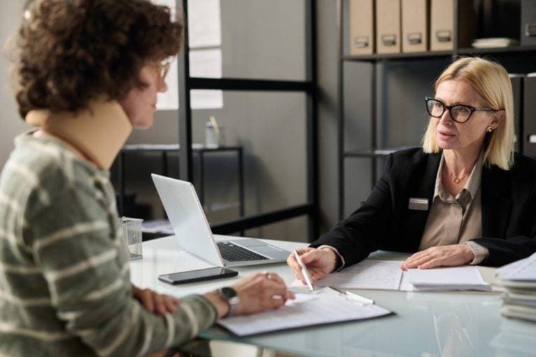 Client discussing New York no-fault insurance claim with an attorney