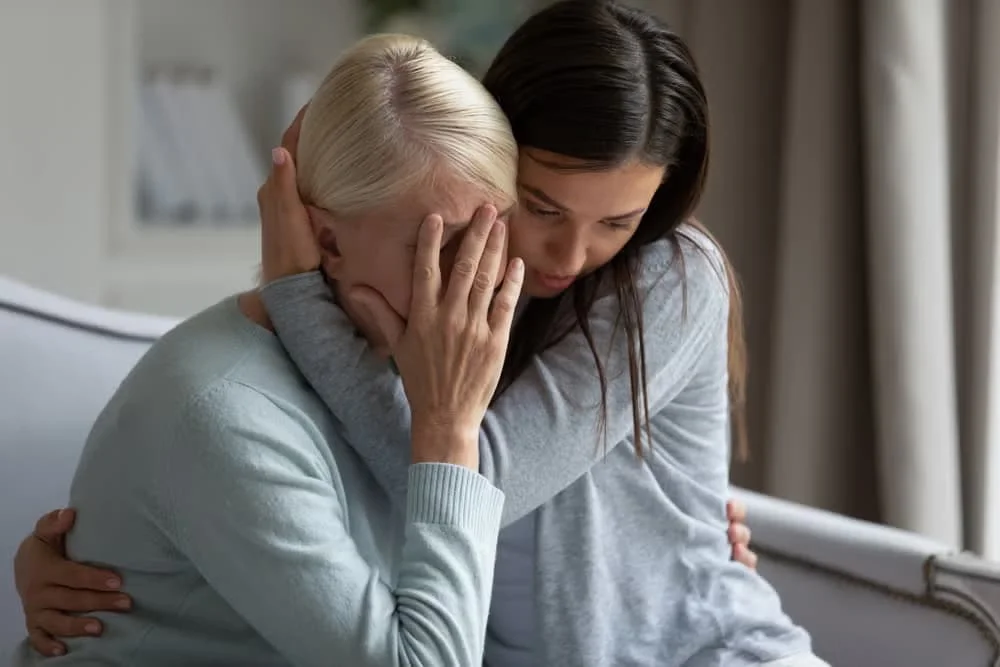 Daughter comforting her grieving mother after losing a loved one — wrongful death claim in New York