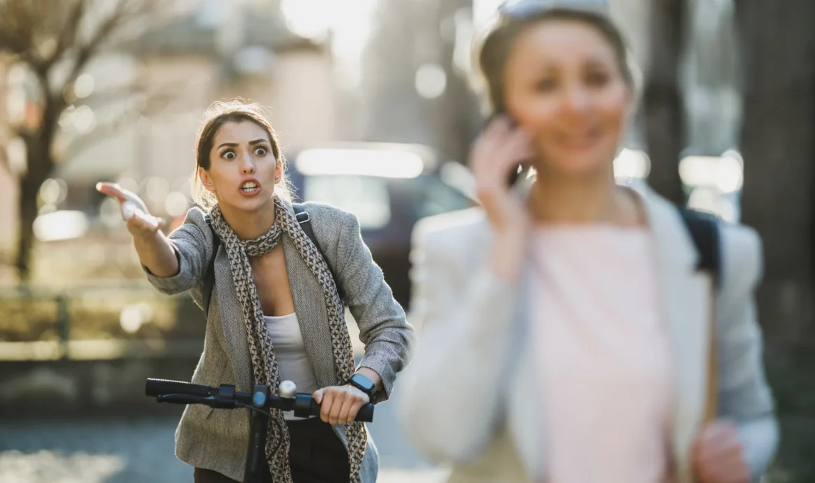 E-scooter rider and pedestrian in a near-collision on an NYC street — the kind of crash a bicycle accident lawyer NYC handles