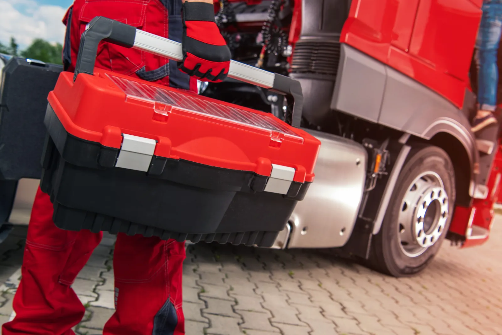 Truck mechanic with a toolbox servicing a commercial truck — negligent truck maintenance lawyer NYC