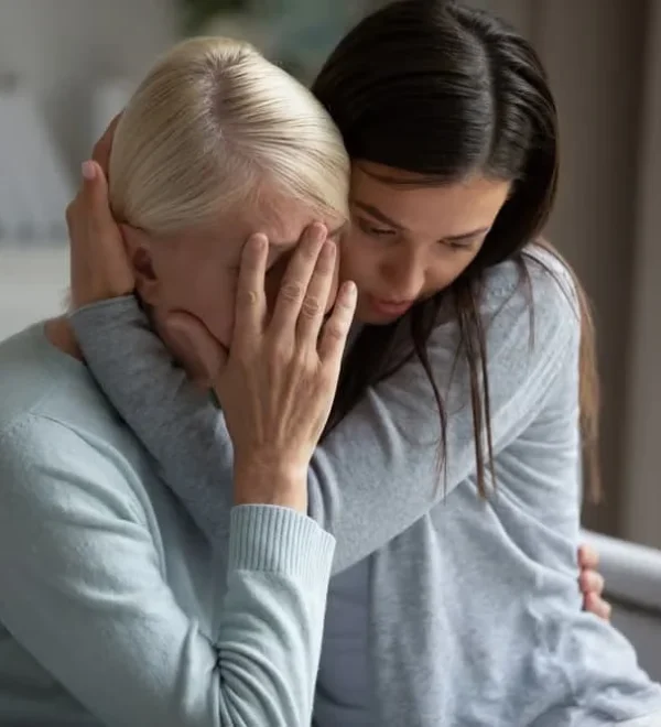Daughter comforting her grieving mother after losing a loved one — wrongful death claim in New York